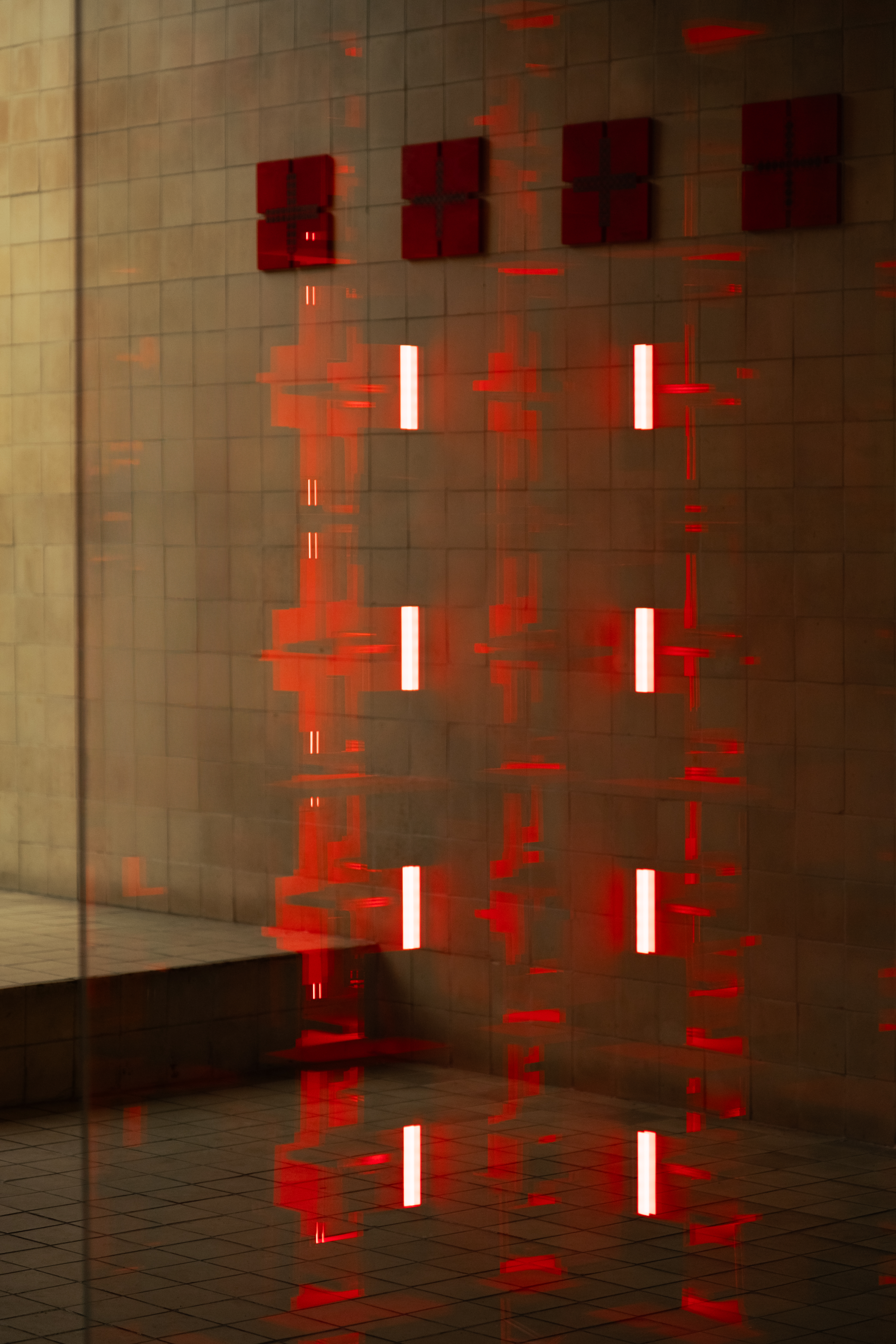 Suspended red modules with LED light lines on glass — Bir Arada — Together installation