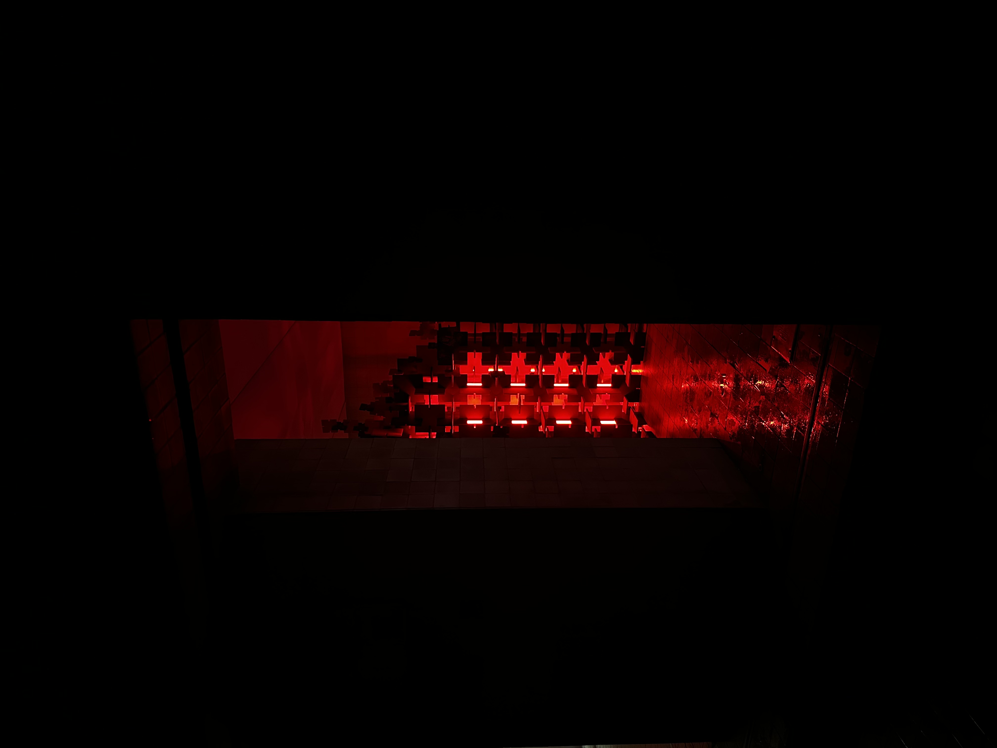 Illuminated installation seen from the darkened street — Bir Arada — Together, Istanbul