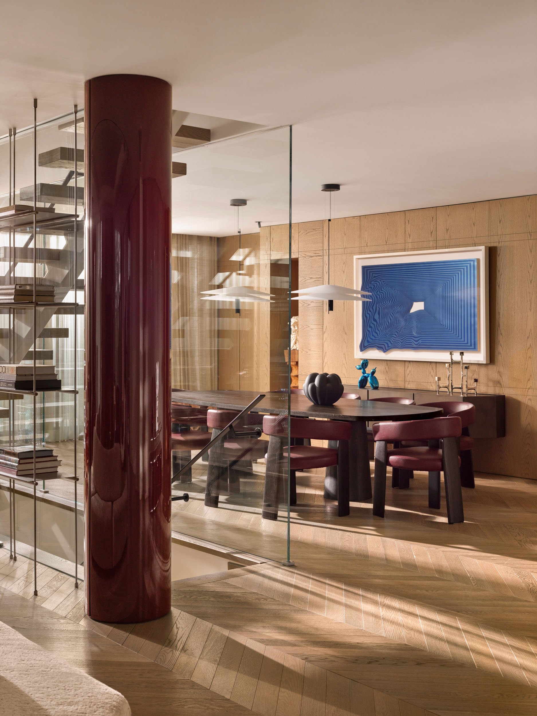 Dining room behind glass partition with oxblood leather chairs — Zekeriyakoy TP House
